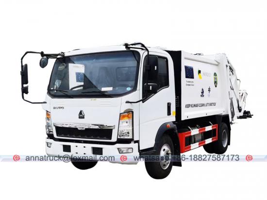 Camión de basura SINOTRUK HOWO RHD de 6cbm a la venta